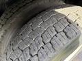 Close-up of a worn tire tread on a 2008 Kenworth T370 showing distinct patterns and grooves worn down from use