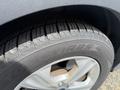 Close-up of a 2015 Ford Escape tire showing detailed tread pattern and the Toyo Tires logo on the sidewall