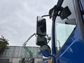 A blue 2017 Autocar Xpert truck showcasing its side and rearview mirrors