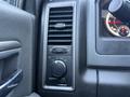 Control panel with air vent and adjustment knobs in a 2018 RAM 5500