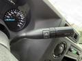 Close-up of the gearshift lever on a 2022 Ford E-450 with buttons for tow/haul and gear selection