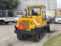 A yellow 2004 Bombardier SW48 vehicle with tracks designed for snow removal featuring a cab and rear attachment area