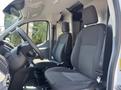 Interior view of a 2019 Ford Transit 350 showing two black upholstered front seats and a steering wheel