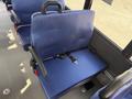 A blue seat with a seatbelt in a 2020 Chevrolet Express interior