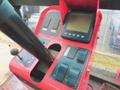 Control panel of a 2013 Toro Grounds Master 5910 featuring levers buttons and a digital display