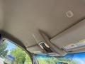 2020 Ram 2500 interior overhead panel featuring lights and a textured ceiling with a sun visor attached