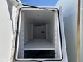Interior of a cargo compartment in a 2008 International DuraStar featuring a spacious layout with a shelf and no visible items inside