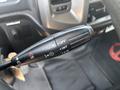 A close-up view of the windshield wiper control stalk from a 2012 Hino 338 featuring settings for off intermittent and low speeds
