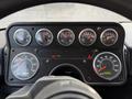 Dashboard of a 2010 Autocar Xpeditor displaying various gauges including speedometer engine hours and warning lights