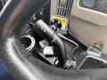 Close-up of the gear shift lever in a 2013 International DuraStar 4300 with various gear positions and control features visible
