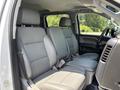 Interior view of a 2020 Chevrolet Silverado showing light gray front and rear seats with a spacious cabin design