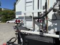 Rear view of a 2008 International DuraStar with various hoses and connections visible including taillights and a ladder