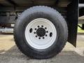 Close-up view of a white wheel and tire from a 2012 International DuraStar 4300 showcasing the tire tread and wheel rim details