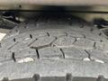 Close-up of a heavily treaded tire from a 2018 Ford F-750 displaying wear and rugged texture