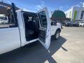 A 2016 Ford F-350 SD with the driver's side door open revealing the interior seating
