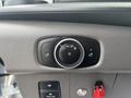 A control panel featuring a round dial with symbols for light settings and two buttons for additional features on a 2021 Ford Transit-350
