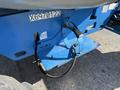 A close-up view of the rear section of a 2012 Genie Z 45/25 lift showing a blue platform with electrical connections and a hydraulic hose attachment point