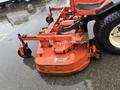A 2012 Kubota F3680 lawn mower with a wide cutting deck and large wheels positioned on a wet surface