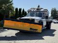 A 2011 Ford F-550 truck equipped with a Meyer Lot Pro snow plow attachment in the front
