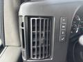 Close-up of an air vent with control buttons in a 2022 GMC Savana van dashboard