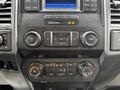 Dashboard controls of a 2019 Ford F-350 SD featuring audio buttons climate control knobs and a display screen
