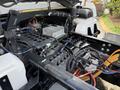 Close-up of the engine compartment of a 2022 Lion Lion6 showing various electrical components wiring and connectors