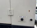 A 2005 Katolight SED60FPJ4 generator front panel featuring a hinge and two buttons labeled WORK LIGHTS