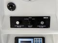 Control panel featuring two volume knobs labeled "Outside Speaker Volume" and "Inside Speaker Volume" along with a switch for "Speaker Select" with options for "Inside," "Outside," and "Both"