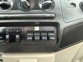 Dashboard controls of a 2008 Ford F-250 SD featuring climate control knobs and four auxiliary switches