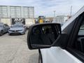 A 2018 Chevrolet Silverado 1500 side mirror reflecting its surroundings