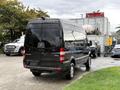 A black 2017 Mercedes-Benz Sprinter van parked with a high roof and large rear doors facing the viewer