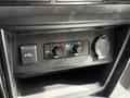 The image shows the control panel of a 2021 Toyota 4Runner with two dials for temperature control and a USB port on the left