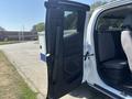 A 2017 Chevrolet Colorado with an open passenger door revealing the interior seating and cabin layout