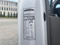A service label attached to a 2020 Chevrolet Express detailing maintenance information including date mileage and engine oil status