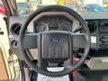 Steering wheel of a 2009 Ford F-450 Super Duty with gauges and controls visible in the background