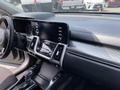 Interior view of a 2022 Kia Sorento showing the dashboard with a touchscreen display climate controls and gear shift