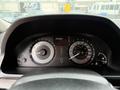 A close-up view of the dashboard of a 2014 Honda Odyssey showing speedometer and fuel gauge with readings displayed