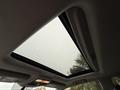 Interior view of a sunroof in a 2018 Toyota 4Runner with a rectangular opening and an overhead console with lights and controls