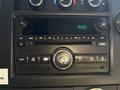 A dashboard display of a 2017 Chevrolet Express featuring a radio and climate control buttons with a digital clock showing 9:55