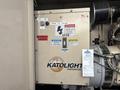 A control panel for a 2005 Katolight SED60FPJ4 generator featuring switches and warning labels for operation