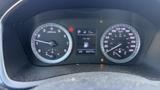 Dashboard display of a 2018 Hyundai Sonata showing speedometer rev counter fuel level and warning indicators