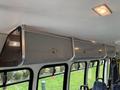 Interior overhead storage compartments in a 2009 Ford Econoline with metal mesh doors and silver handles