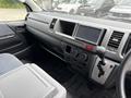 Interior view of a 2009 Toyota Hiace showing the dashboard gear shifter control panel and air conditioning vents