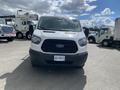 A 2019 Ford Transit van facing forward with a white exterior and black grille