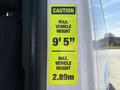 A caution sign on a 2019 Mercedes-Benz Sprinter indicating maximum vehicle height of 9 feet 5 inches and 2.89 meters