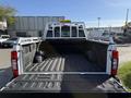 2021 Ford F-250 SD with a spacious bed featuring a metal frame and storage boxes on each side
