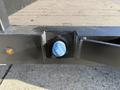 Close-up of a blue valve on the side of a 2020 Ford F-550 truck near the flatbed area