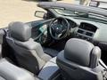 A 2004 BMW 6-Series convertible with leather seats and a modern dashboard featuring gauges and a central control panel