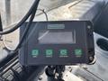 A Digiload display unit with a screen and buttons labeled MENU MOVE UP MOVE DOWN and ENTER mounted on a control panel in a vehicle