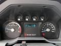 Dashboard of a 2012 Ford F-450 SD showing speedometer, fuel gauge, and digital information display with mileage and trip data
